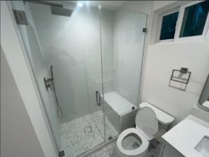 Audrey's bathroom includes a walk-in shower, toilet and sink.
